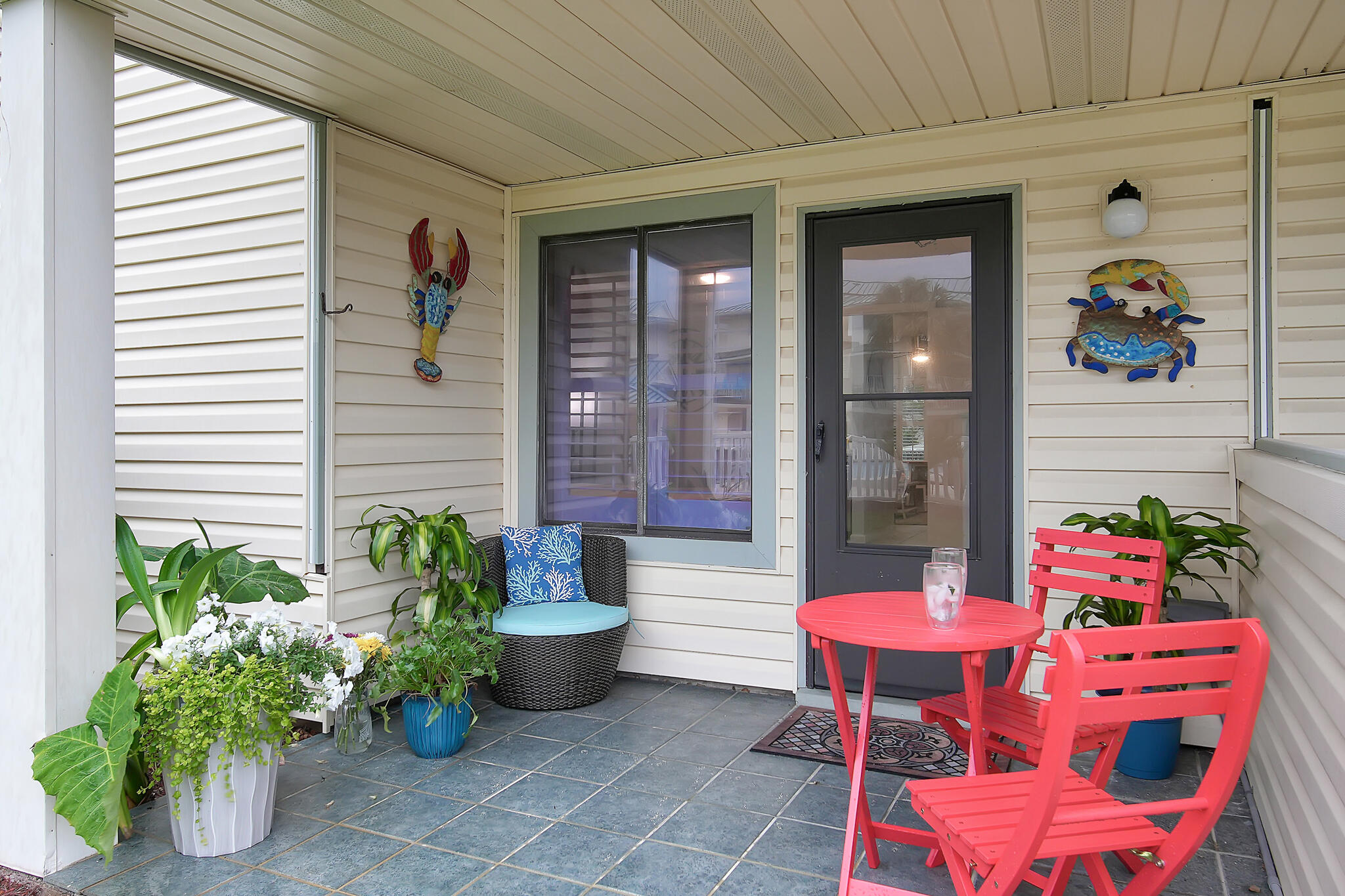 60 Sandprints Drive, Unit E7 Miramar Beach, FL 32550 - Photo 19 of 26 a front view of a house with outdoor seating