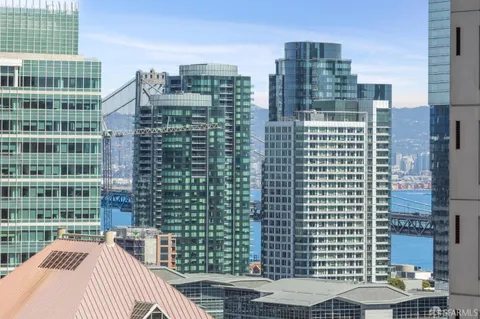 a living room with furniture lamps and wooden floor