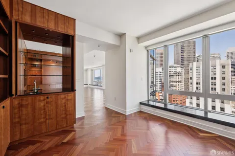 a large kitchen with kitchen island granite countertop a refrigerator and a sink