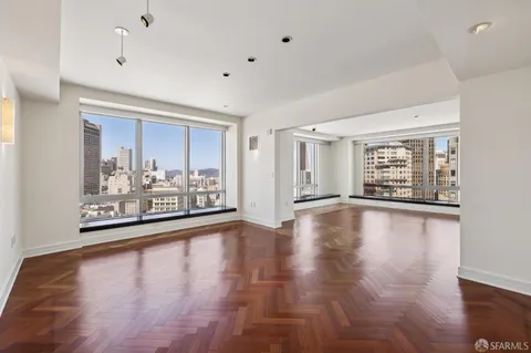 a view of a big room with cabinet and mirrors