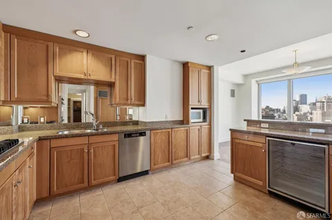 a view of a kitchen with a sink and a window