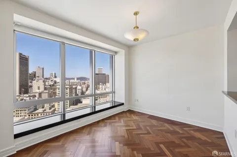 a bathroom with a granite countertop sink a mirror and shower