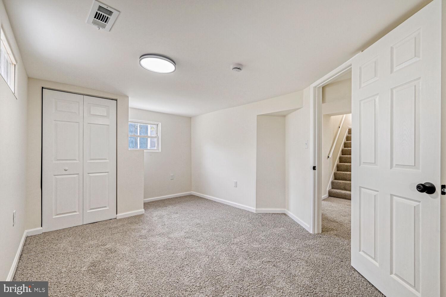 207 South Rock Glen Road Baltimore, MD 21229 - Photo 22 of 28 Bright and versatile basement space.