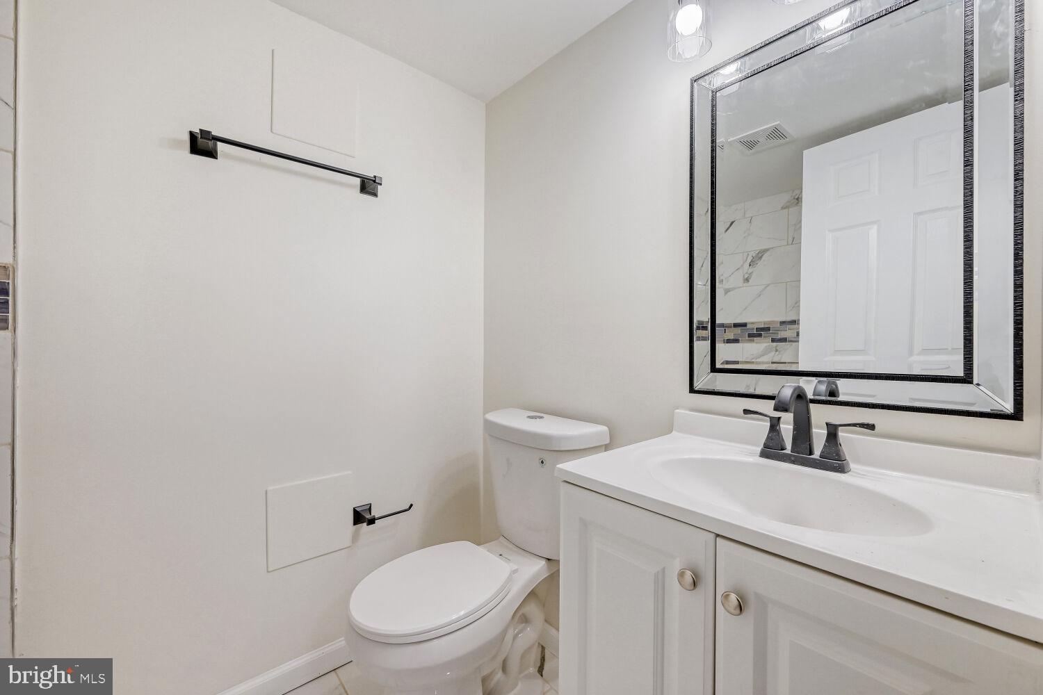207 South Rock Glen Road Baltimore, MD 21229 - Photo 24 of 28 Modern bathroom with sleek finishes.