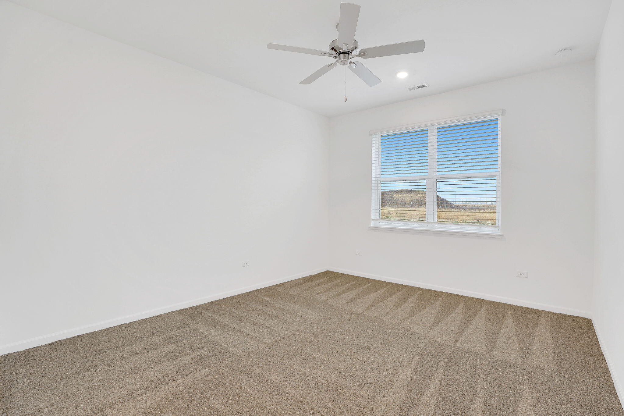 12541 Virginia Street Crown Point, IN 46307 - Photo 15 of 24 an empty room with a window and ceiling fan