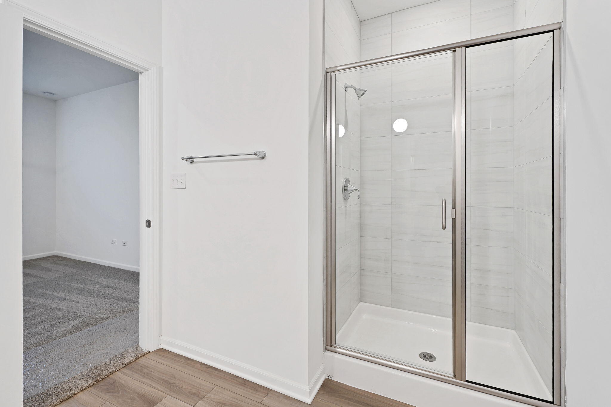 12541 Virginia Street Crown Point, IN 46307 - Photo 20 of 24 a bathroom with a glass shower door