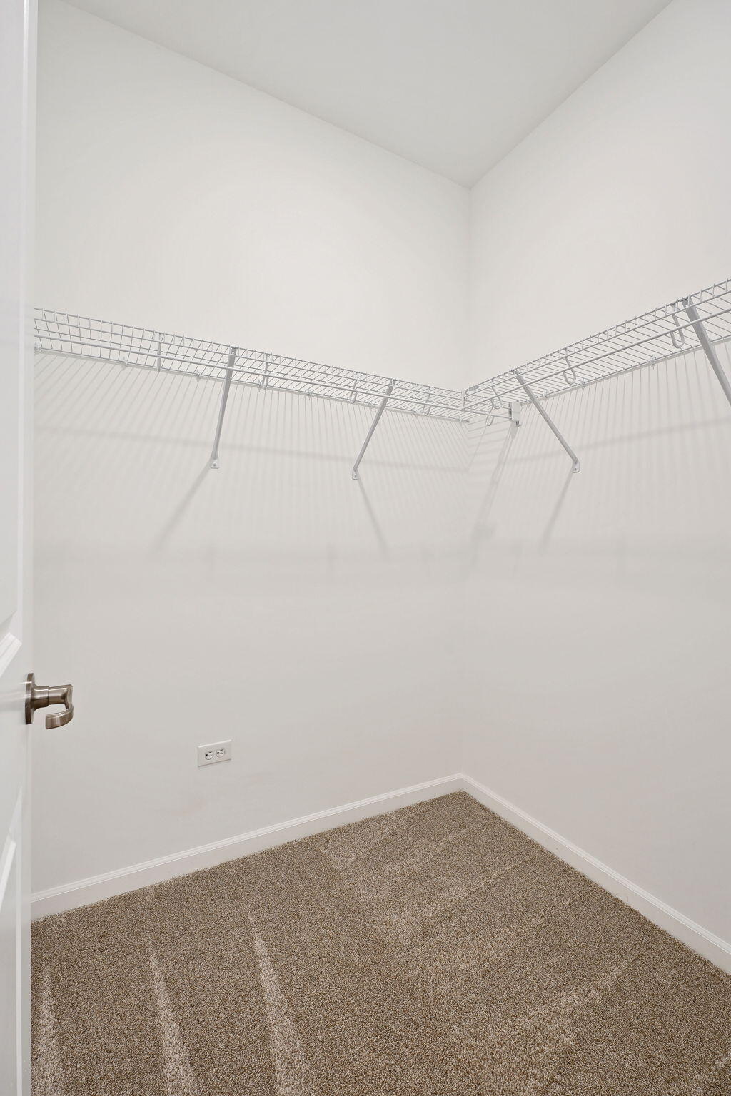 12541 Virginia Street Crown Point, IN 46307 - Photo 21 of 24 a view of a room with racks on the wall