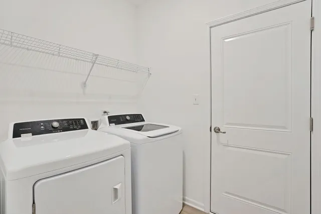 a utility room with dryer and washer