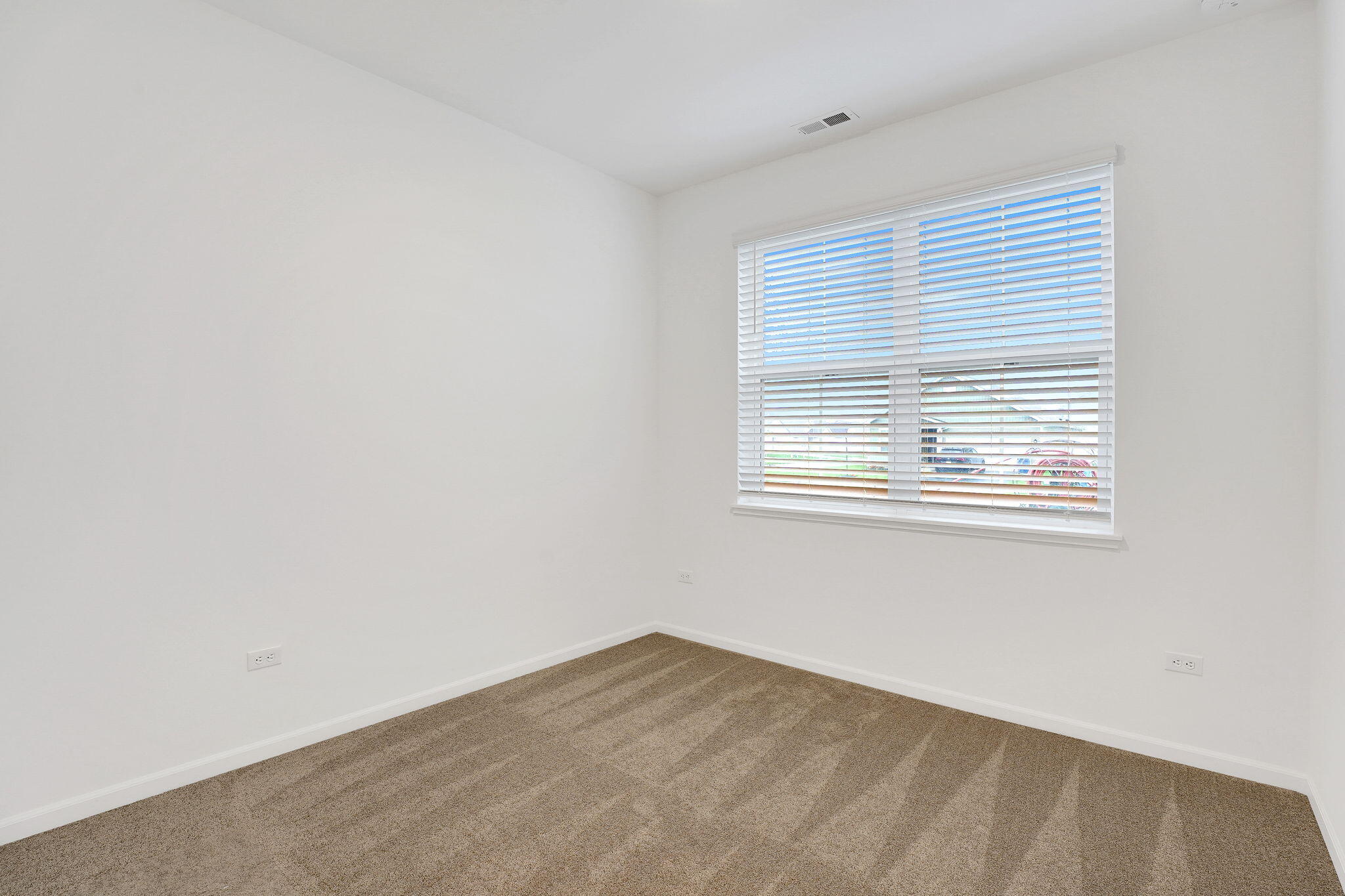 12541 Virginia Street Crown Point, IN 46307 - Photo 3 of 24 a view of an empty room with a window