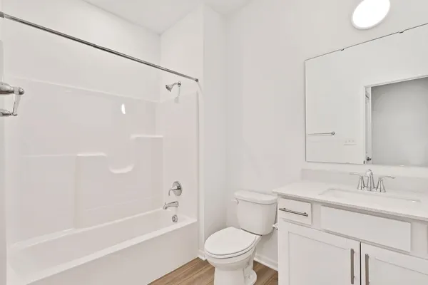 a bathroom with a sink a toilet and a bathtub