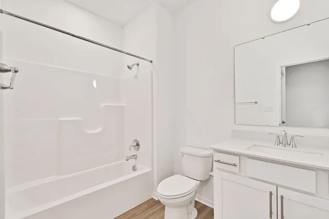 a bathroom with a sink a toilet and a bathtub