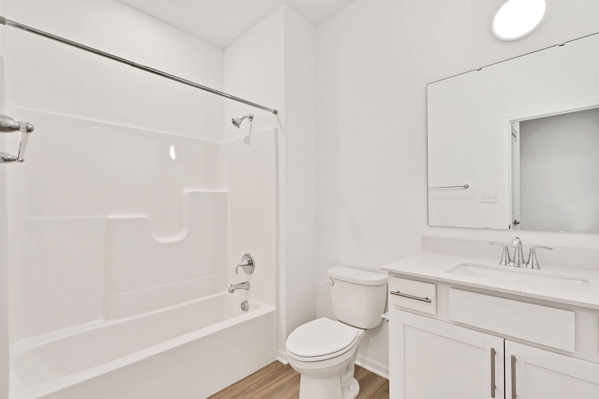 12541 Virginia Street Crown Point, IN 46307 - Photo 5 of 24 a bathroom with a sink a toilet and a bathtub