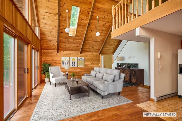 a dining room with a table chairs and a kitchen view