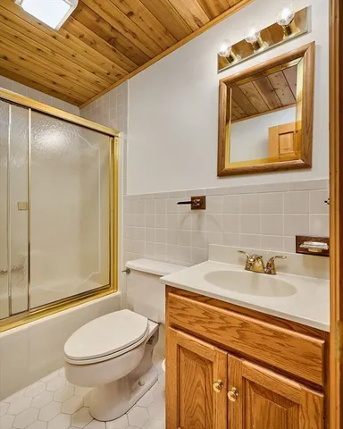 a balcony with wooden floor and outdoor space