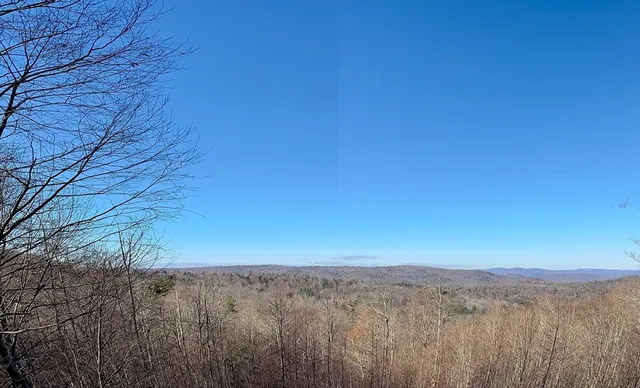 a balcony with trees in front of it