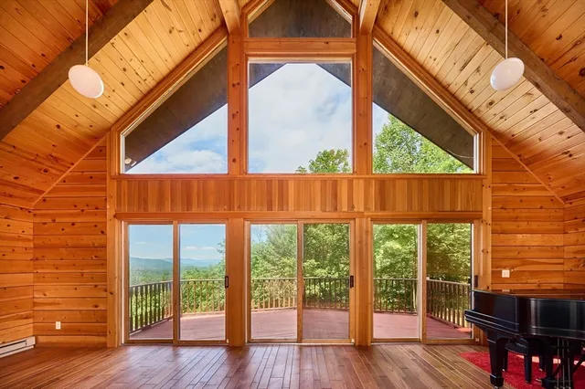a view of outdoor space with wooden floor and furniture