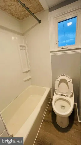 a bathroom with a sink a toilet and a bathtub