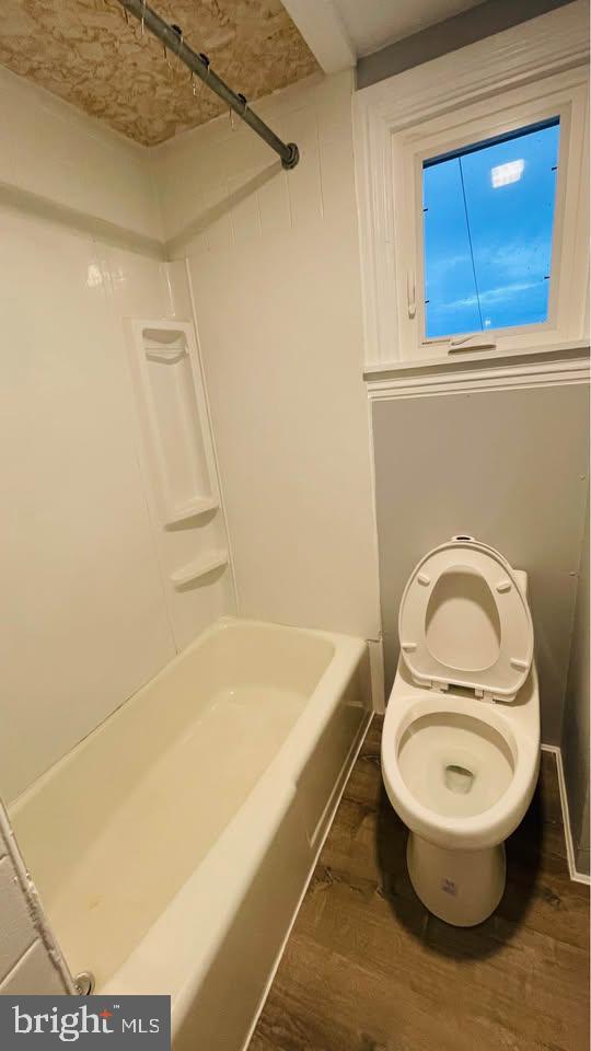 153 Main Street, Unit 4 Phoenixville, PA 19460 - Photo 5 of 9 a bathroom with a sink a toilet and a bathtub
