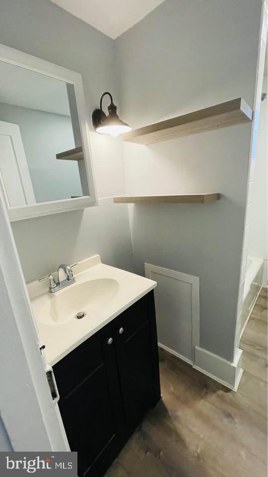 153 Main Street, Unit 4 Phoenixville, PA 19460 - Photo 6 of 9 a bathroom with a sink vanity and mirror
