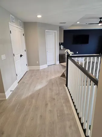 a view of an empty room with stairs