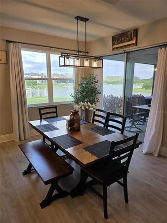 a view of a dining room with furniture window and outside view