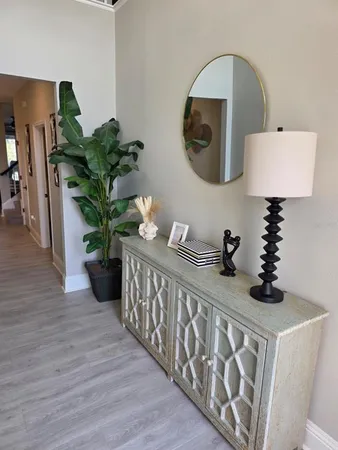 a living room with furniture and a potted plant