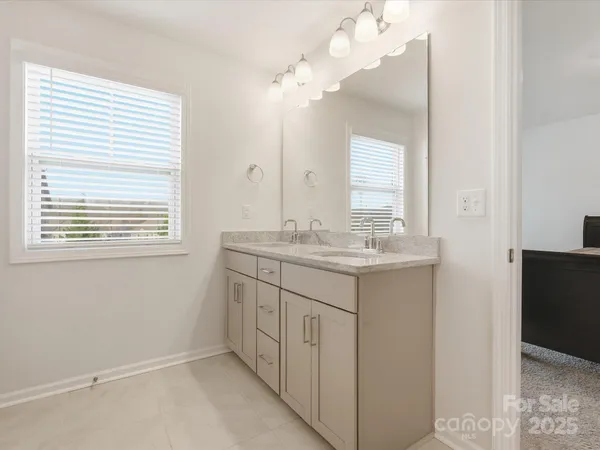 a bathroom with a sink a vanity and a mirror