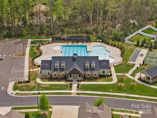an aerial view of a house with garden space ocean view