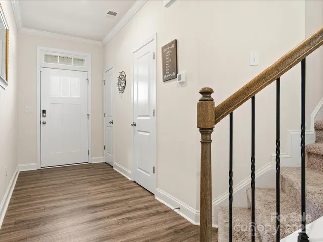 a view of an entryway with wooden floor
