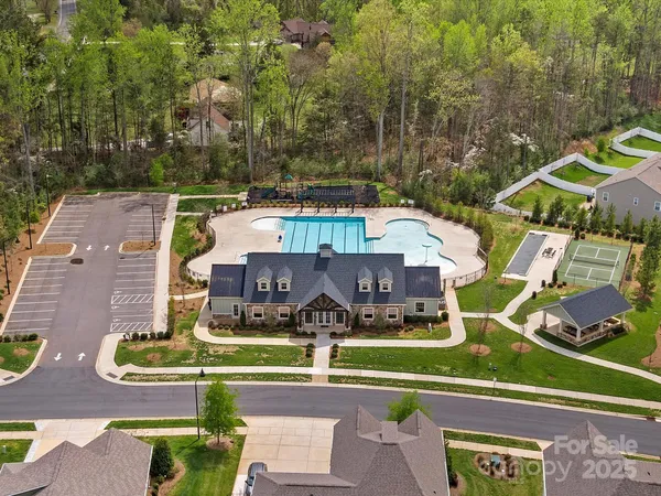 an aerial view of a house with swimming pool