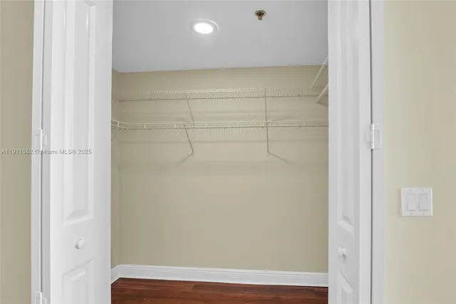 a view of hallway with furniture and a window