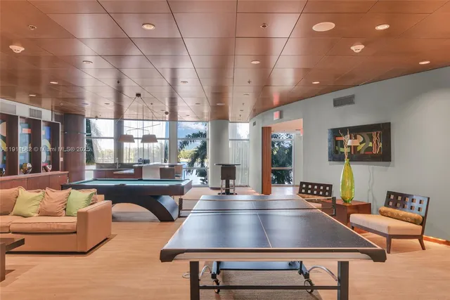 a view of a swimming pool with furniture