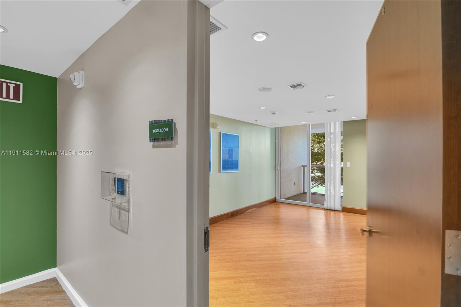 2681 North Flamingo Road, Unit 1903S Sunrise, FL 33323 - Photo 45 of 55 a view of an empty room with wooden floor and a window