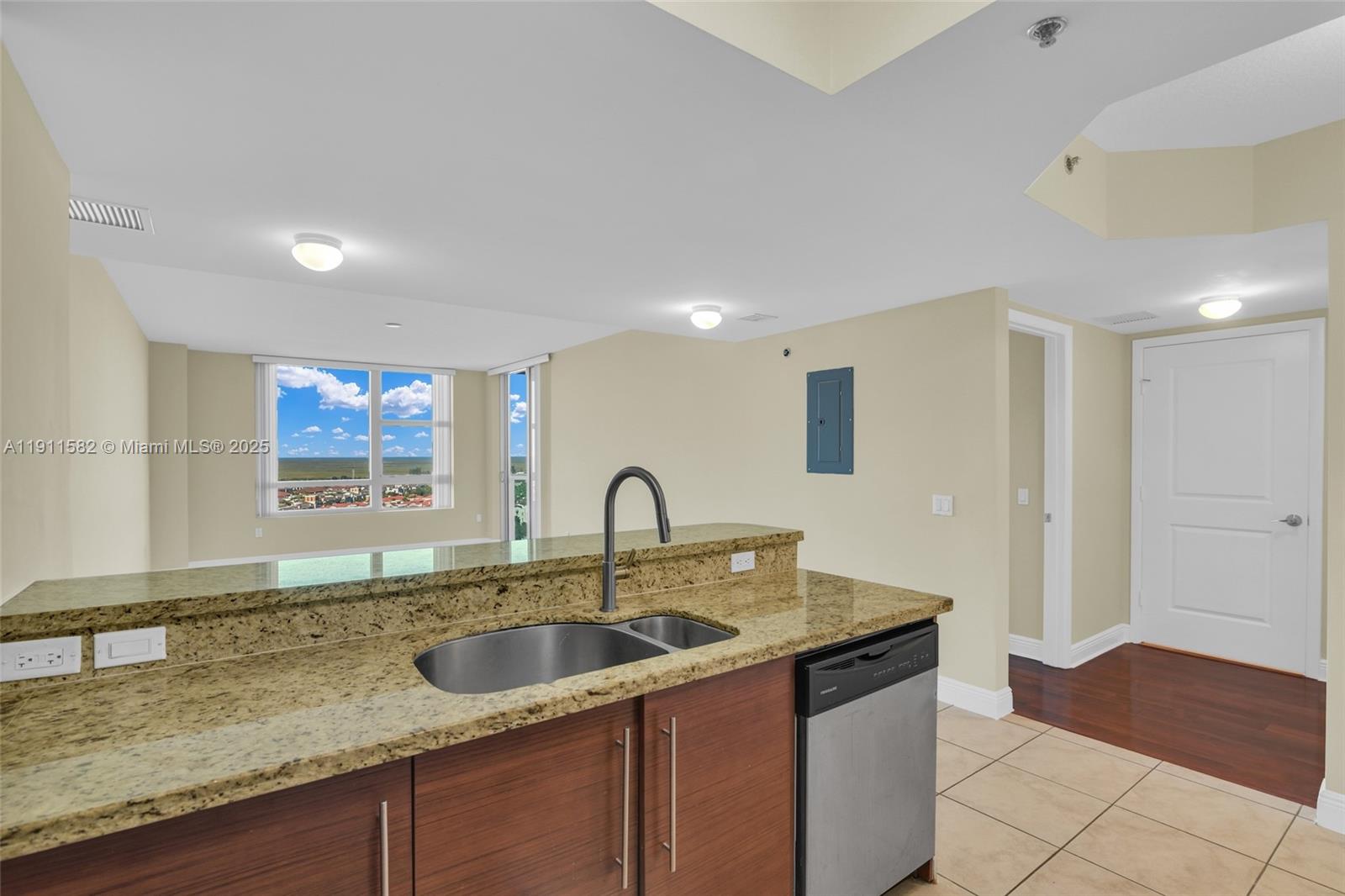 2681 North Flamingo Road, Unit 1903S Sunrise, FL 33323 - Photo 9 of 55 a kitchen with a sink and a counter top space