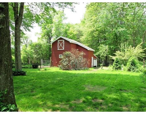 48 St George Road Brimfield, MA 01010 - Photo 24 of 29 a view of a wooden house with a big yard and large trees