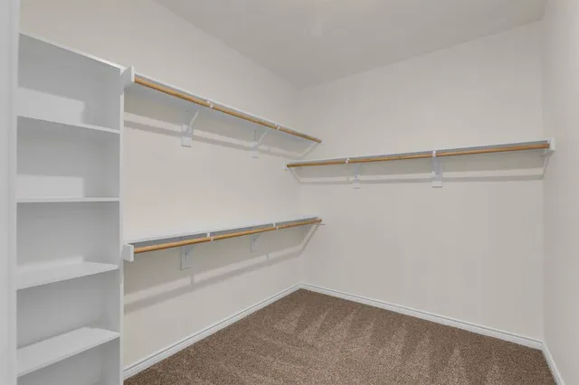 a view of an empty walk in closet