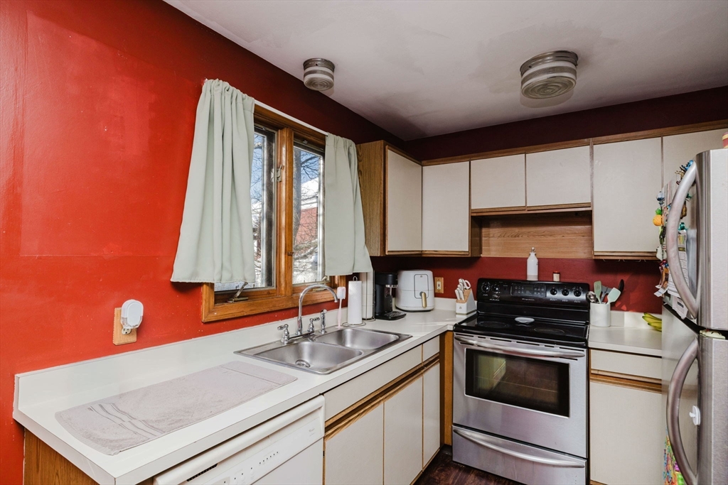 195 Crescent Street, Unit 3 Fall River, MA 02720 - Photo 11 of 34 a kitchen that has a sink and a stove top oven