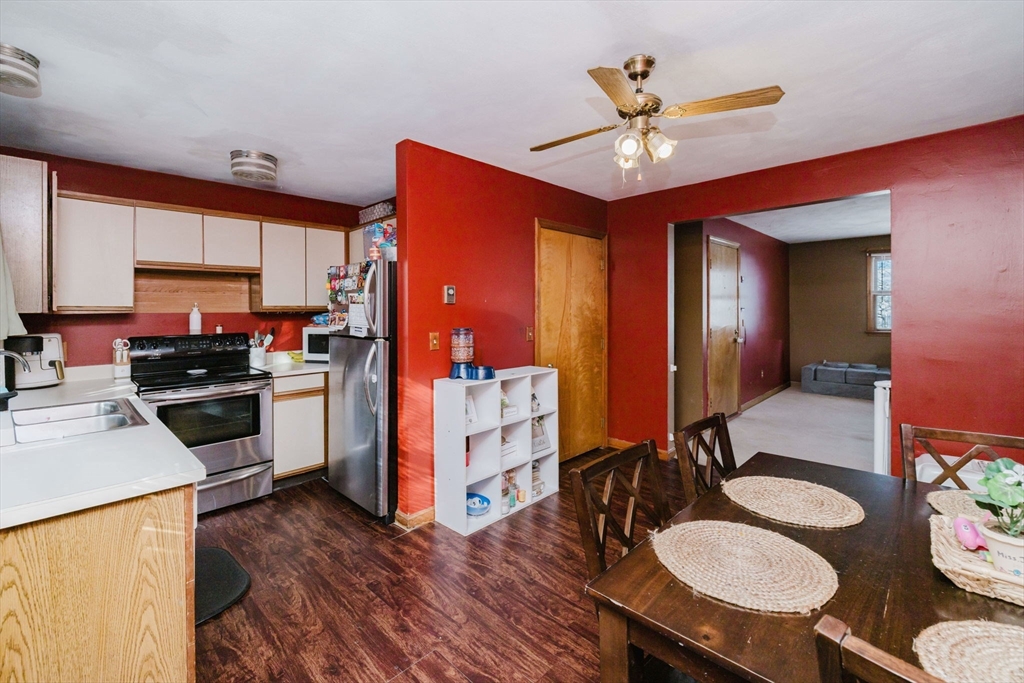195 Crescent Street, Unit 3 Fall River, MA 02720 - Photo 15 of 34 a kitchen with stainless steel appliances a stove a chimney a sink and cabinets