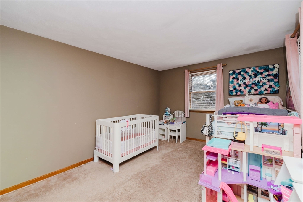 195 Crescent Street, Unit 3 Fall River, MA 02720 - Photo 22 of 34 a room with toys and dresser with wooden floor