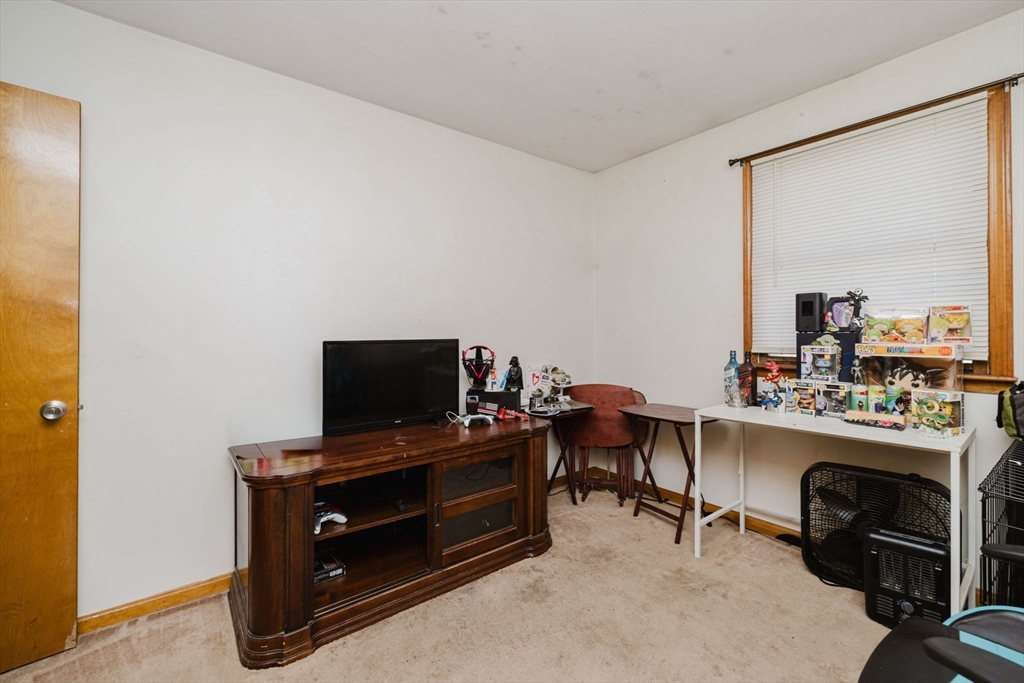195 Crescent Street, Unit 3 Fall River, MA 02720 - Photo 27 of 34 a view of a workspace with furniture and a window