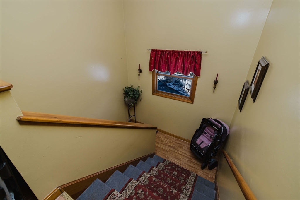 195 Crescent Street, Unit 3 Fall River, MA 02720 - Photo 29 of 34 a room with furniture and wall painting