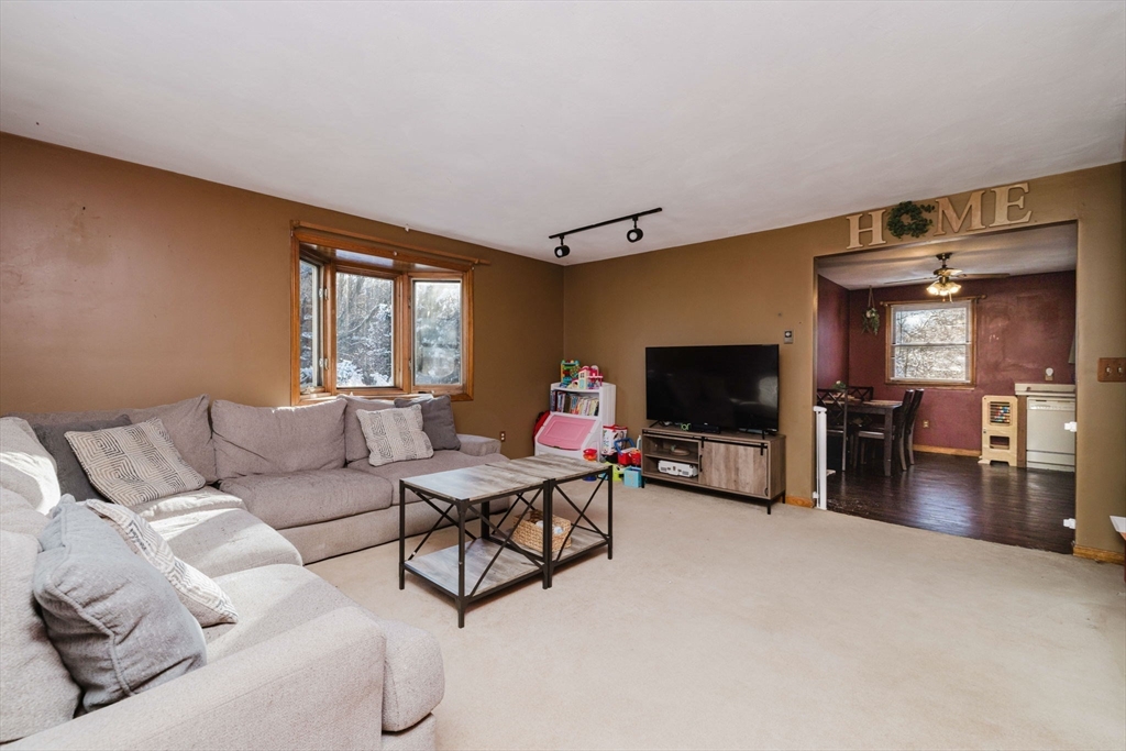 195 Crescent Street, Unit 3 Fall River, MA 02720 - Photo 5 of 34 a living room with furniture and a flat screen tv