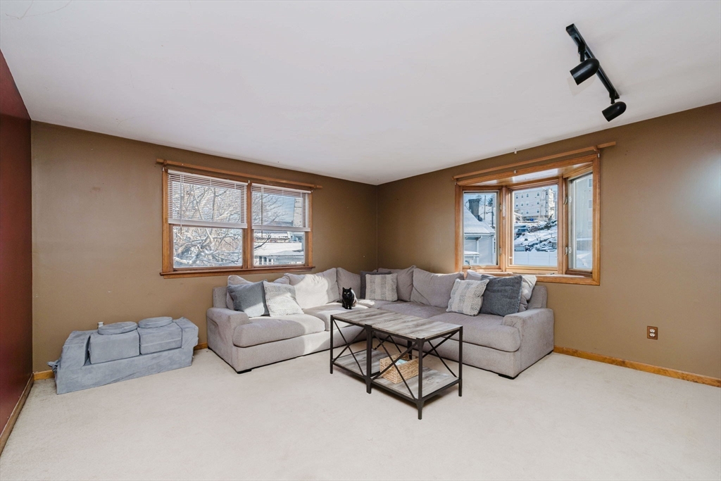 195 Crescent Street, Unit 3 Fall River, MA 02720 - Photo 6 of 34 a living room with furniture and a window