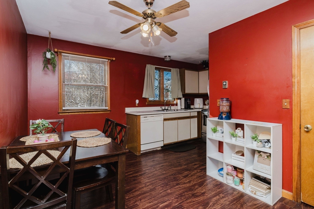 195 Crescent Street, Unit 3 Fall River, MA 02720 - Photo 9 of 34 a kitchen that has a table chairs and cabinets in it