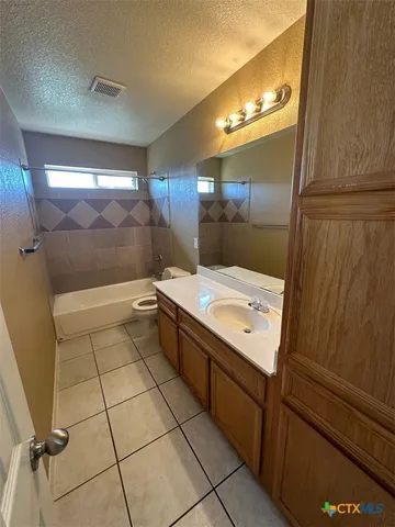 a bathroom with a sink a mirror and a shower