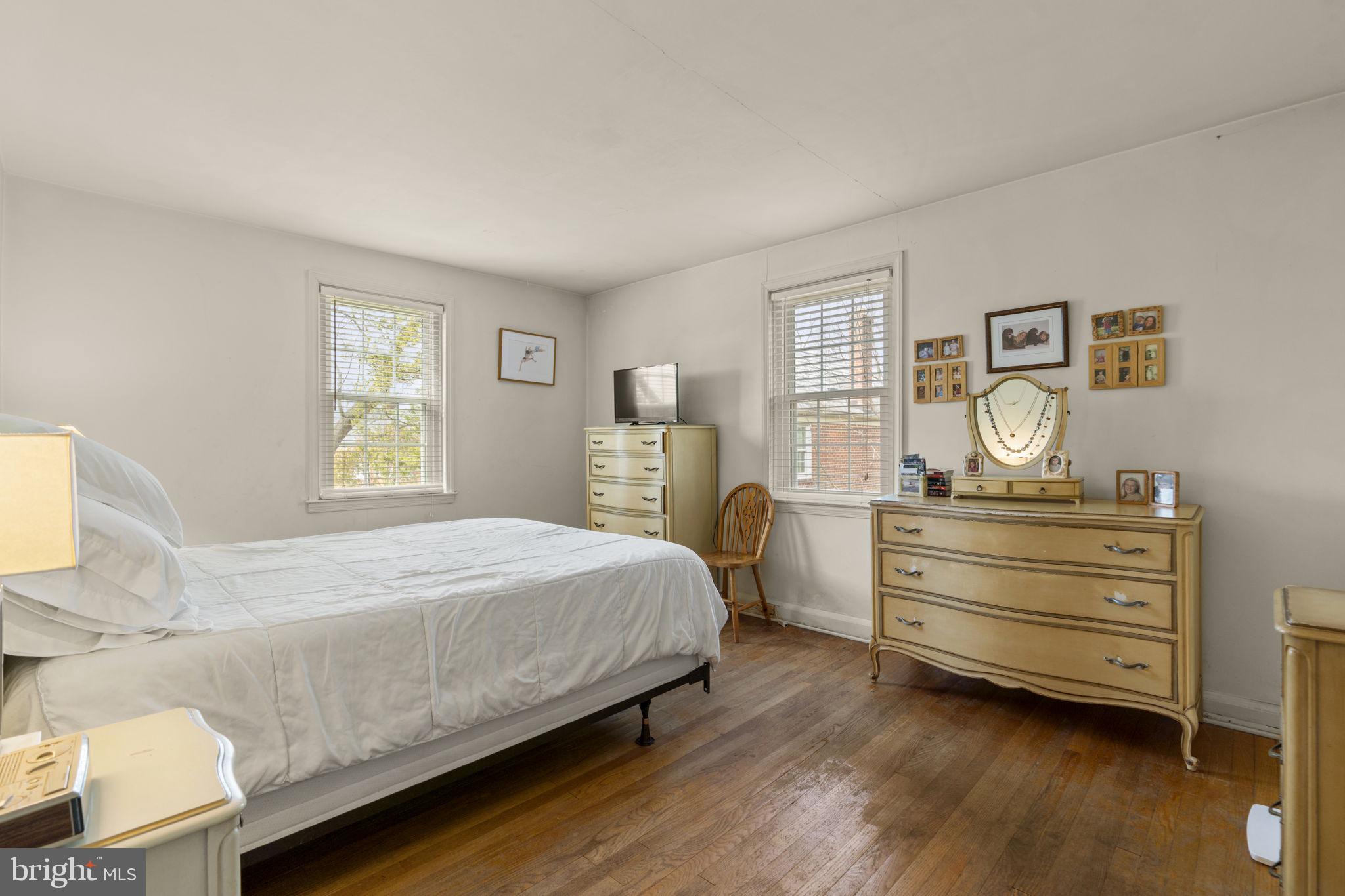 7413 Stanmore Court Baltimore, MD 21212 - Photo 15 of 38 a bedroom with a bed and window