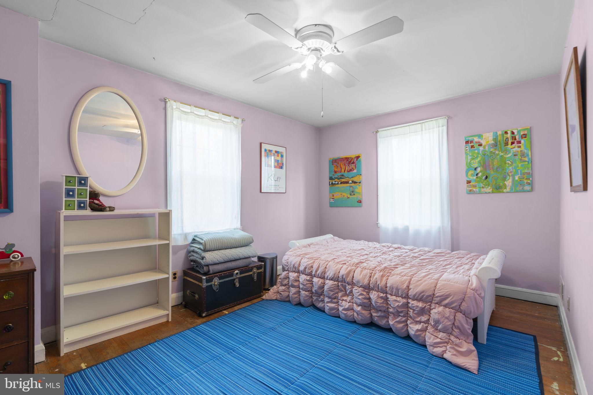 7413 Stanmore Court Baltimore, MD 21212 - Photo 20 of 38 a bedroom with a bed mirror and a window