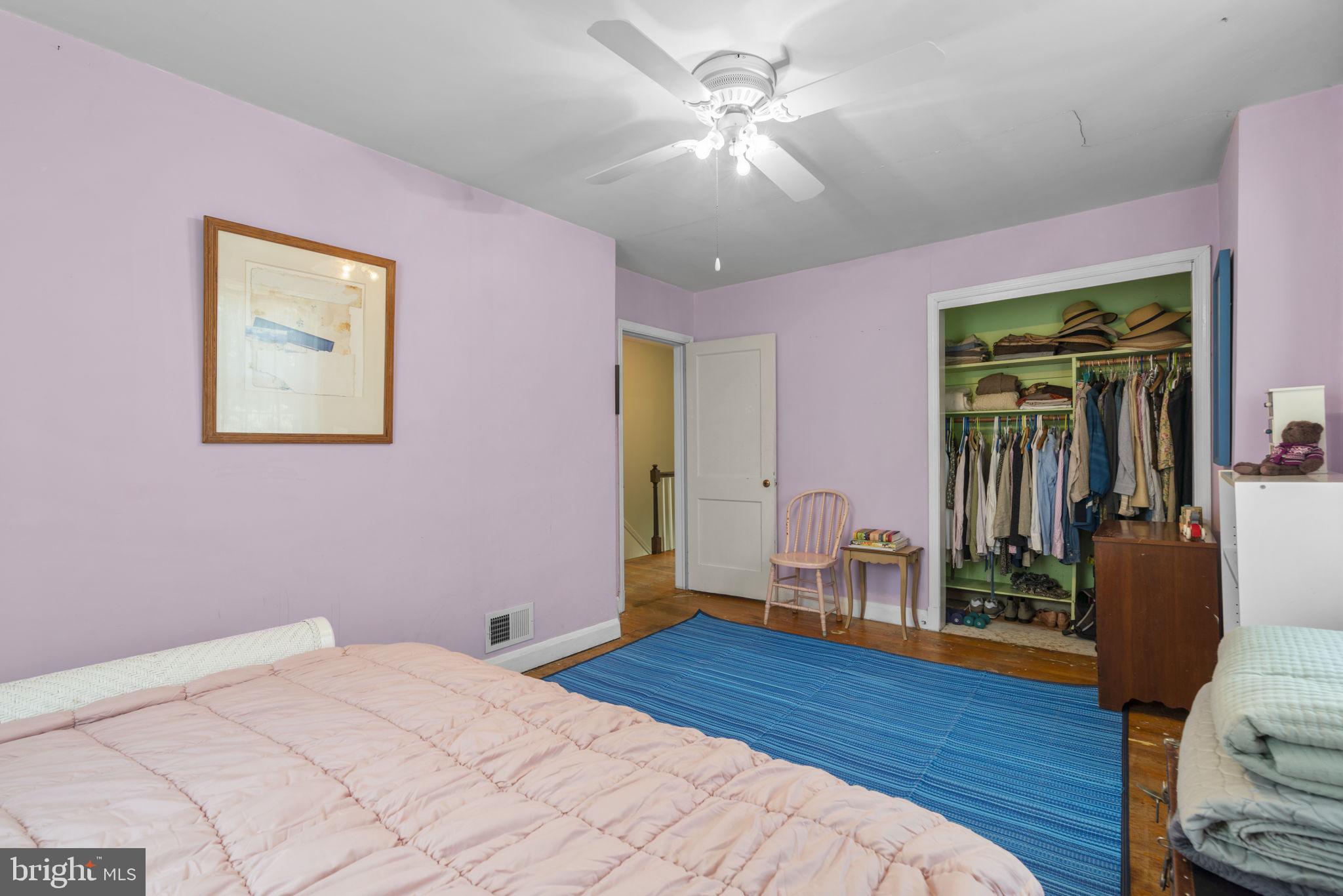 7413 Stanmore Court Baltimore, MD 21212 - Photo 21 of 38 a bedroom with a bed and a chandelier