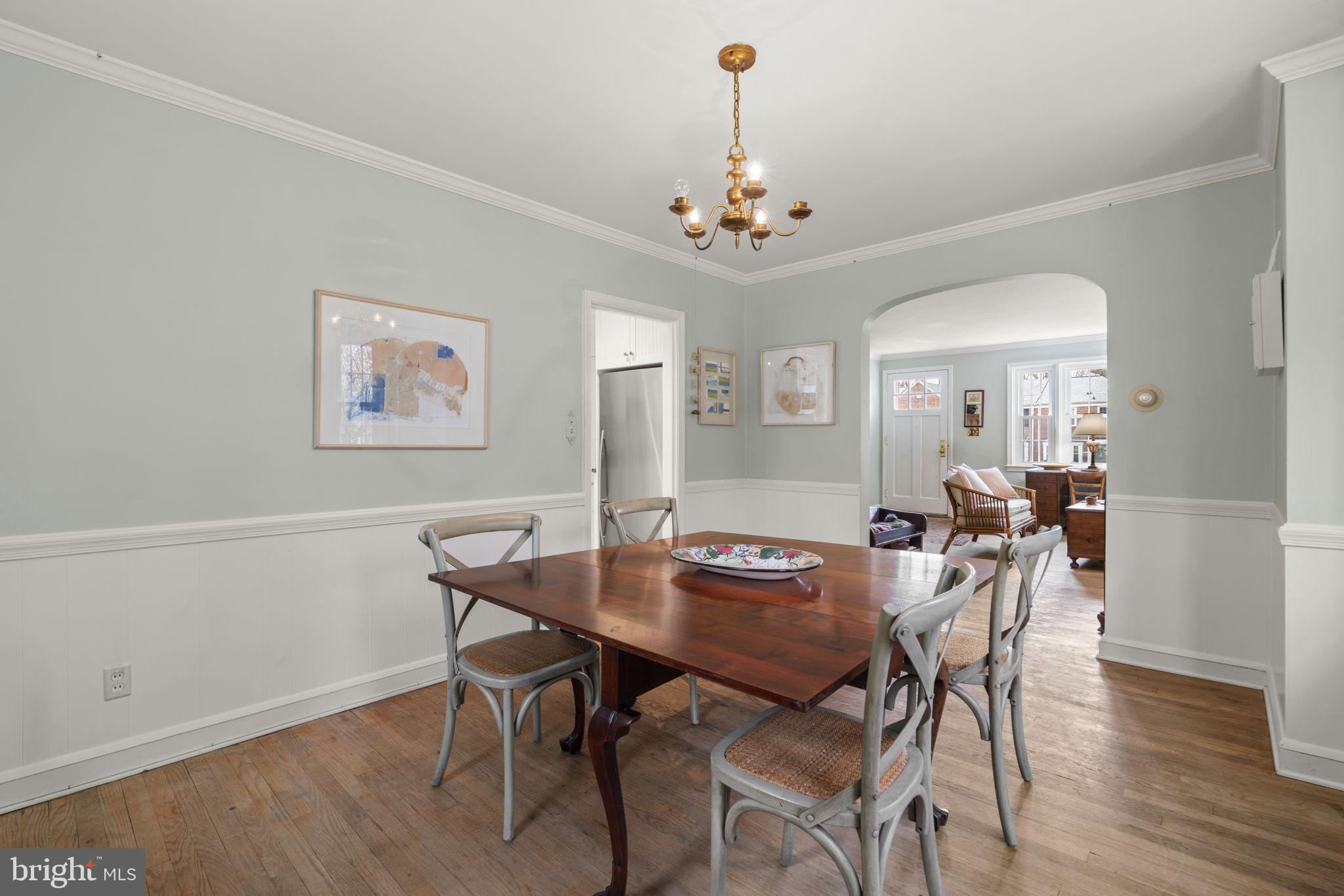 7413 Stanmore Court Baltimore, MD 21212 - Photo 9 of 38 a view of a dining room with furniture wooden floor and a chandelier