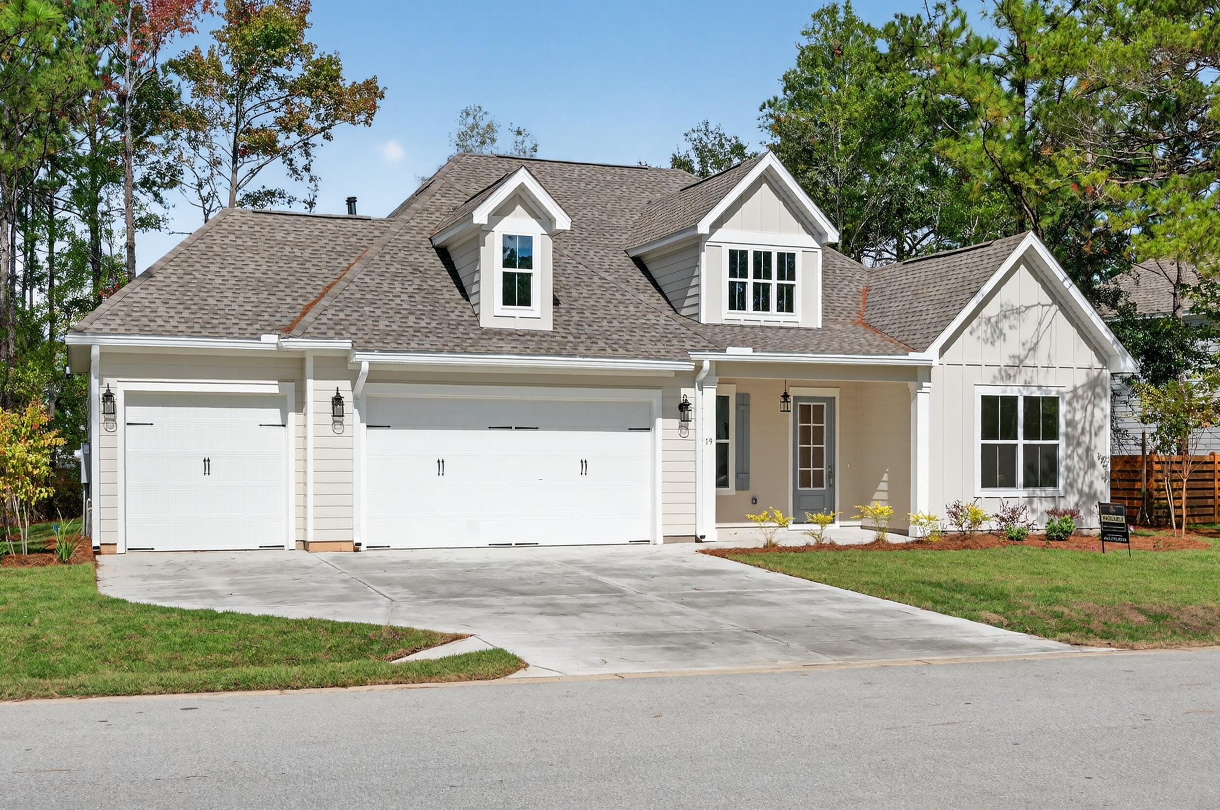 19 North J Hunter's Way, Unit LOT 22 Freeport, FL 32439 - Photo 1 of 48 a front view of a house with a yard
